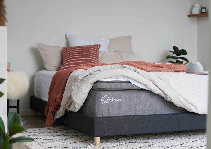 Image of Sherman mattress in stylish bedroom 