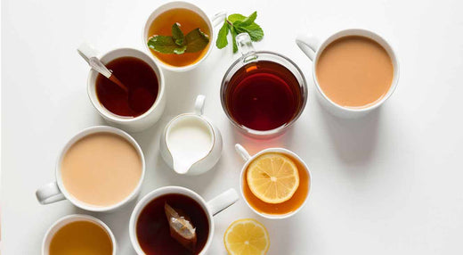Assorted tea cups with different teas for article about avoiding caffeine to sleep better